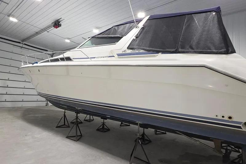Slide: The Image of 1989 Sea Ray 420 Sundancer yacht in indoor storage on stands. - 3