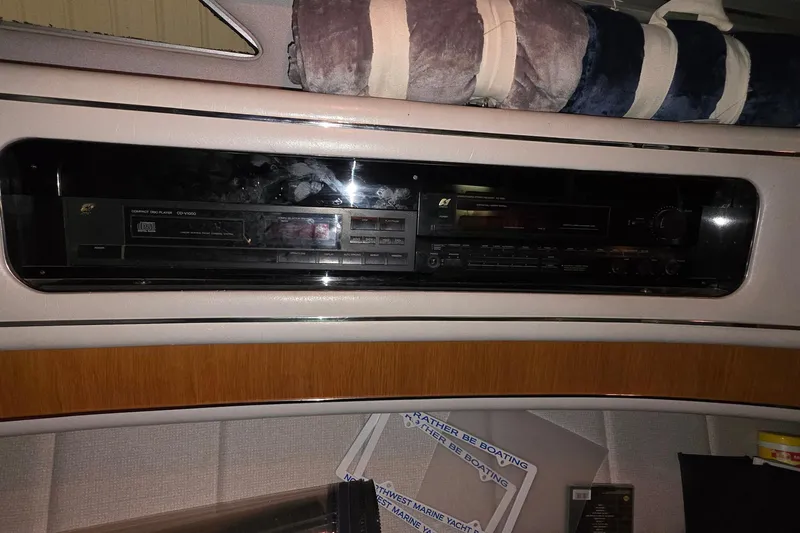 Slide: The Image of 1989 Sea Ray 420 Sundancer interior with vintage stereo system and decor. - 36