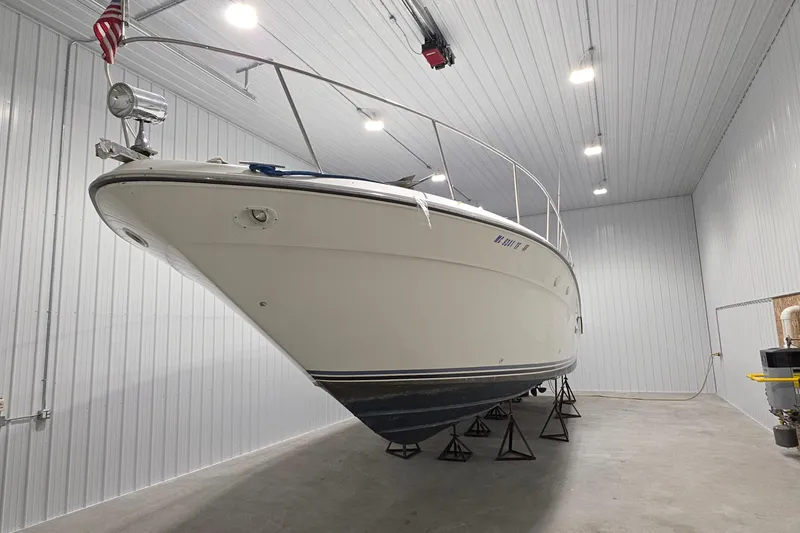 Slide: The Image of 1989 Sea Ray 420 Sundancer yacht stored indoors on stands. - 4