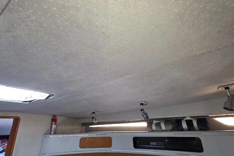 Slide: The Image of Interior cabin ceiling of 1989 Sea Ray 420 Sundancer boat with lighting fixtures. - 65
