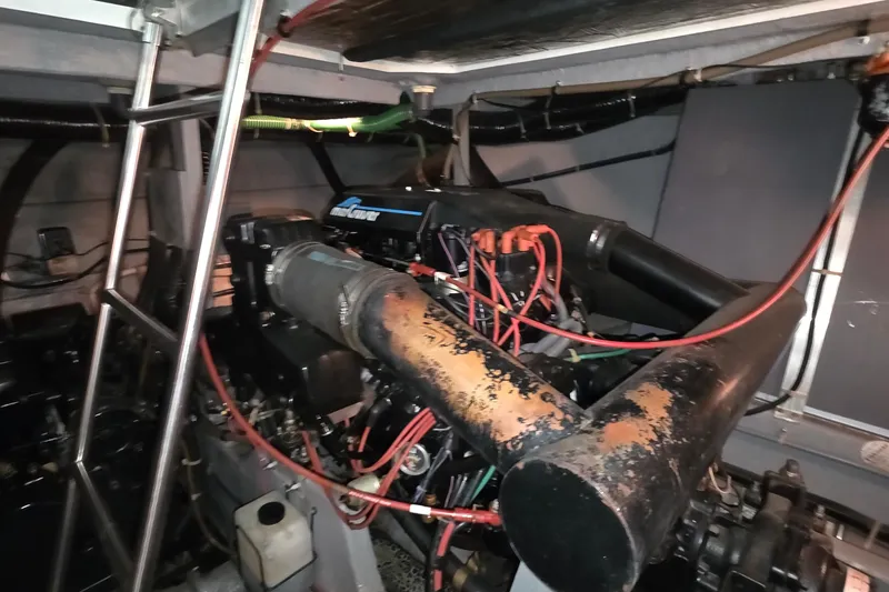 Slide: The Image of Engine room of a 1989 Sea Ray 420 Sundancer boat with visible components. - 66