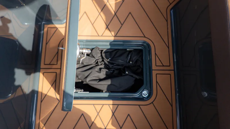 Slide: The Image of Cobalt R6 2026 boat with open storage compartment lid. - 11