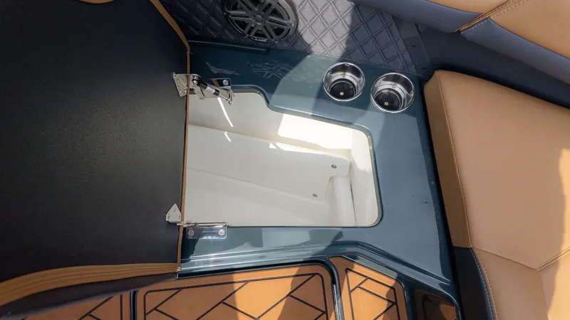Slide: The Image of 2026 Cobalt R6 interior with storage compartment and cup holders. - 23