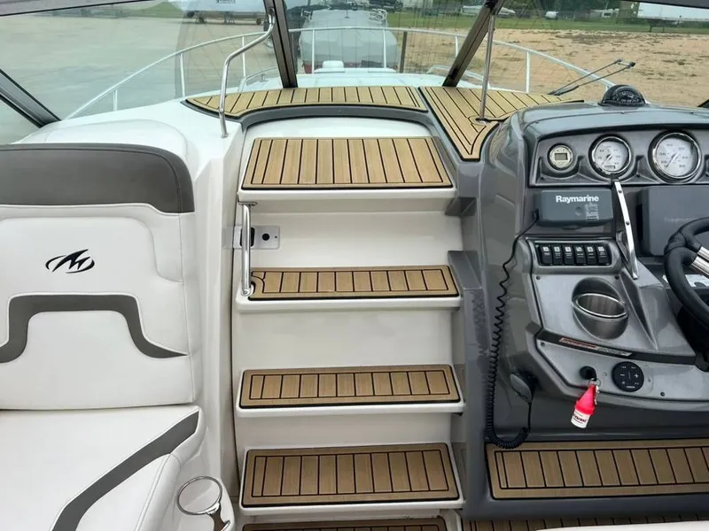 Slide: The Image of Interior of a 2011 Monterey 260 SCR yacht with helm console. - 10