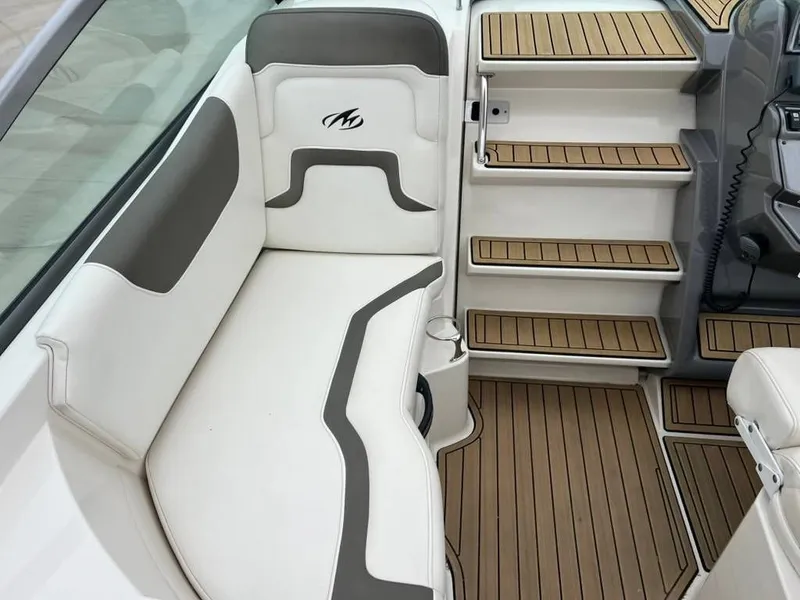 Slide: The Image of Interior of a 2011 Monterey 260 SCR boat with white seating. - 11
