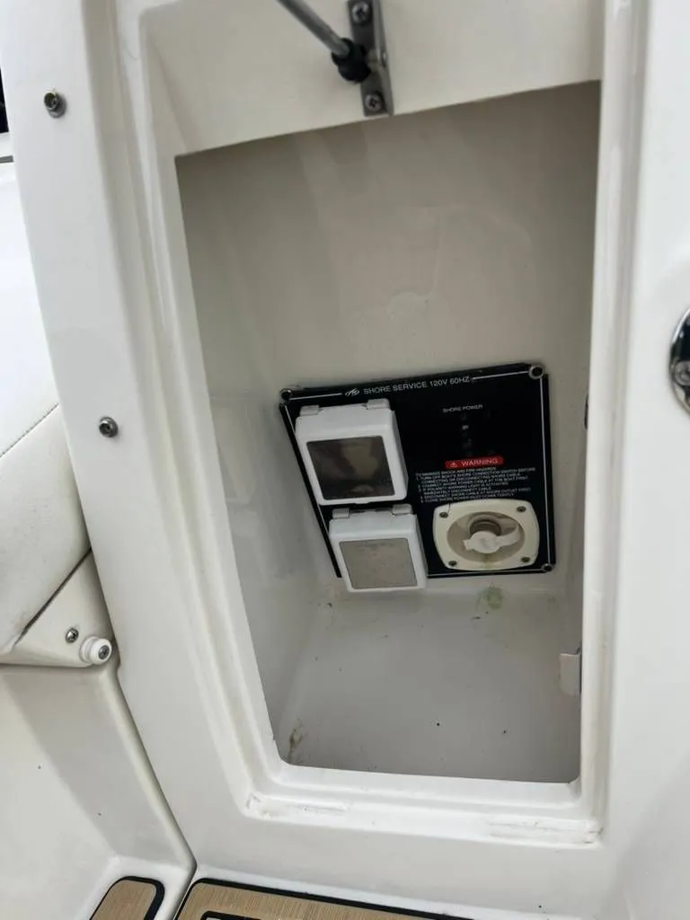 Slide: The Image of Electrical connection area of a 2011 Monterey 260 SCR boat. - 12
