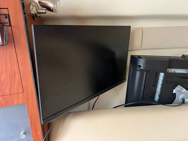 Slide: The Image of Interior of a 2011 Monterey 260 SCR with television. - 22