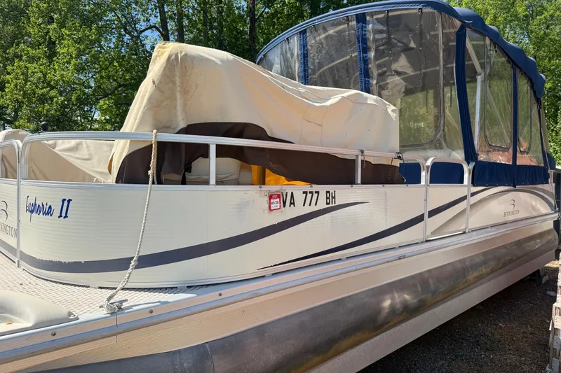 Slide: The Image of 2005 Bennington 2575RL pontoon boat with canopy, docked outdoors. - 3