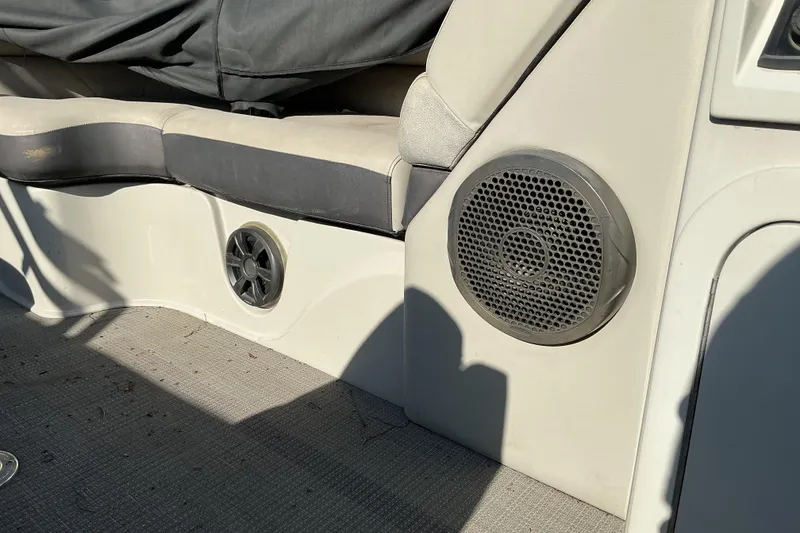 Slide: The Image of Interior of 2019 Crest Classic 230 SLC boat with speakers and seating. - 10