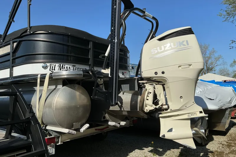 Slide: The Image of 2019 Crest Classic 230 SLC pontoon boat with Suzuki outboard motor. - 3