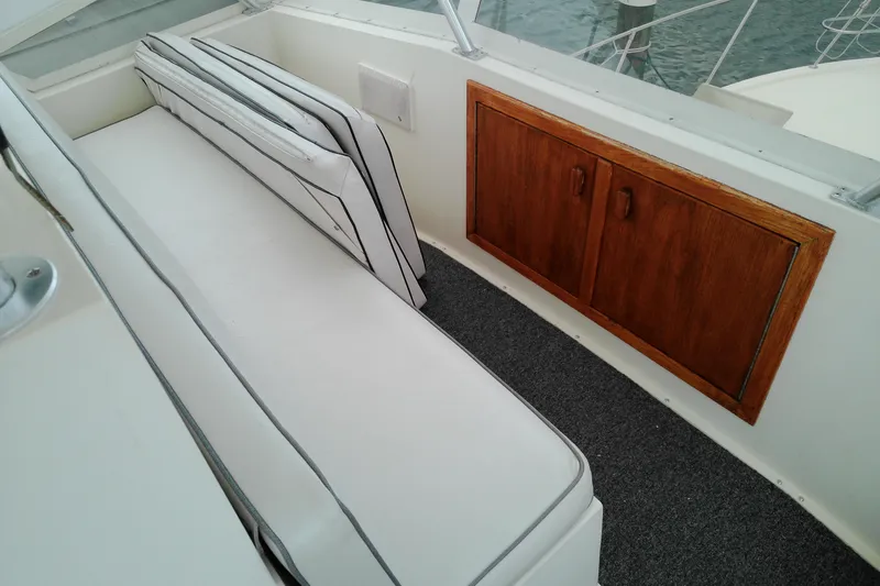 Slide: The Image of Interior seating and wooden cabinet on 1986 Viking 44 Motor Yacht. - 11