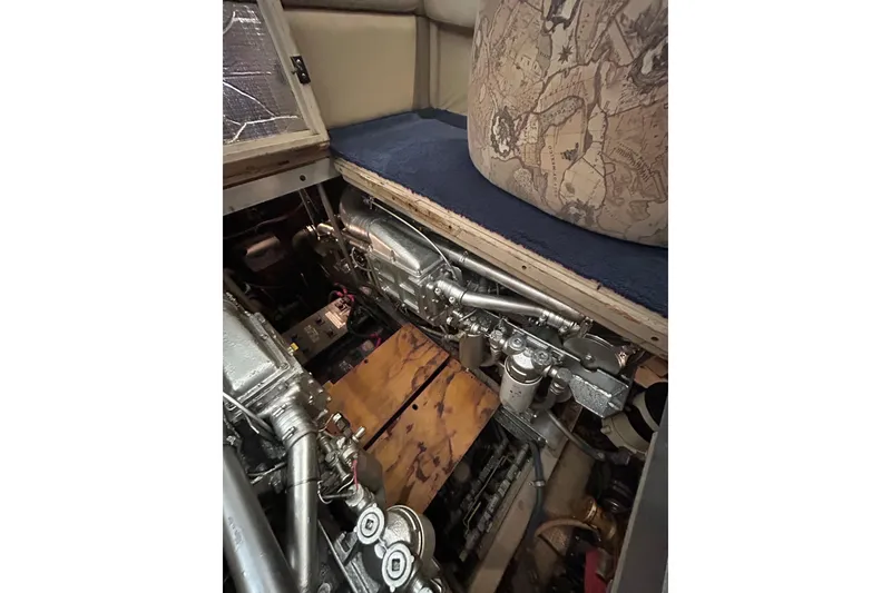 Slide: The Image of Engine room of a 1986 Viking 44 Motor Yacht, showcasing mechanical components. - 30