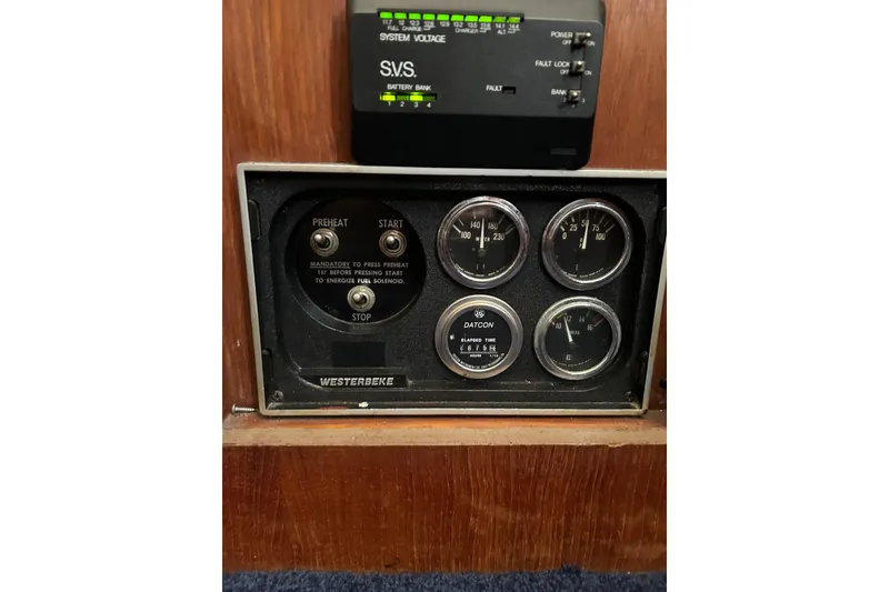 Slide: The Image of Control panel of a 1986 Viking 44 Motor Yacht with gauges and switches. - 33