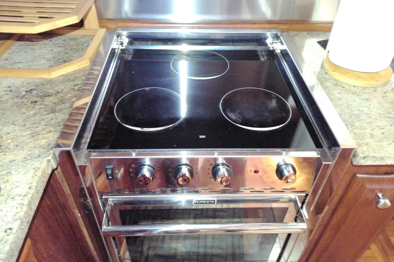 Slide: The Image of Electric stove in 1986 Viking 44 Motor Yacht kitchen with granite countertops. - 42