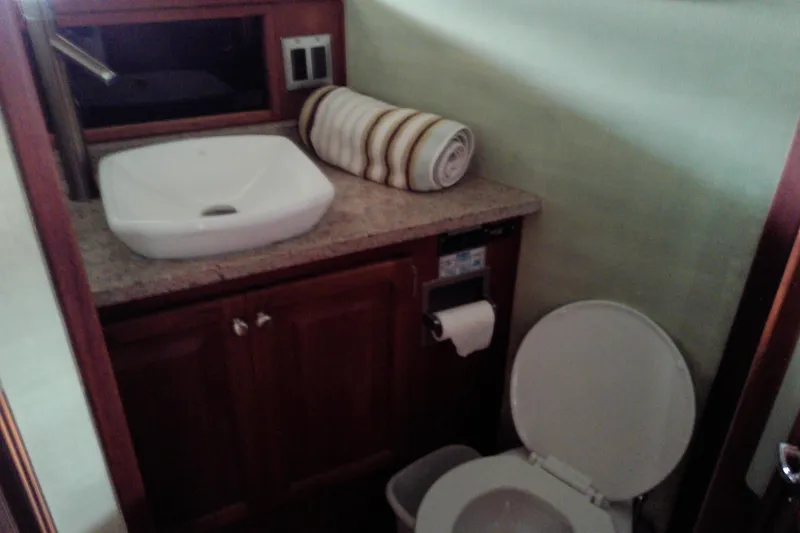 Slide: The Image of Bathroom interior of 1986 Viking 44 Motor Yacht with sink and toilet. - 47
