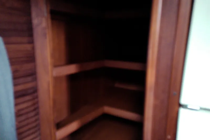 Slide: The Image of Wooden interior shelving on a 1986 Viking 44 Motor Yacht. - 51