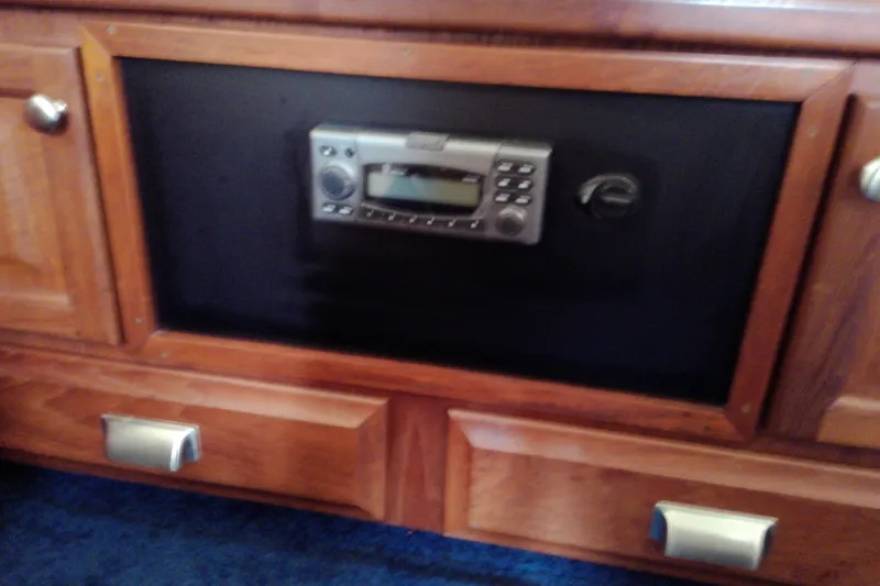 Slide: The Image of Wooden interior of 1986 Viking 44 Motor Yacht with built-in stereo system. - 52