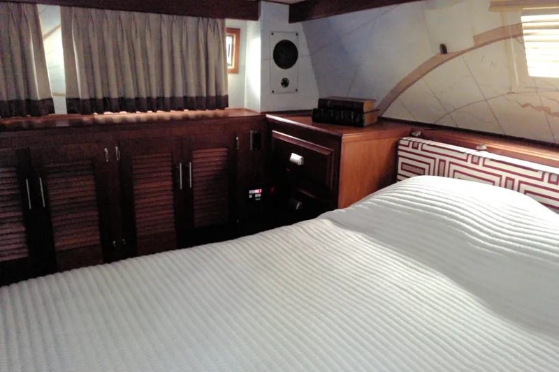 Slide: The Image of Interior cabin of 1986 Viking 44 Motor Yacht with bed and wooden cabinetry. - 59