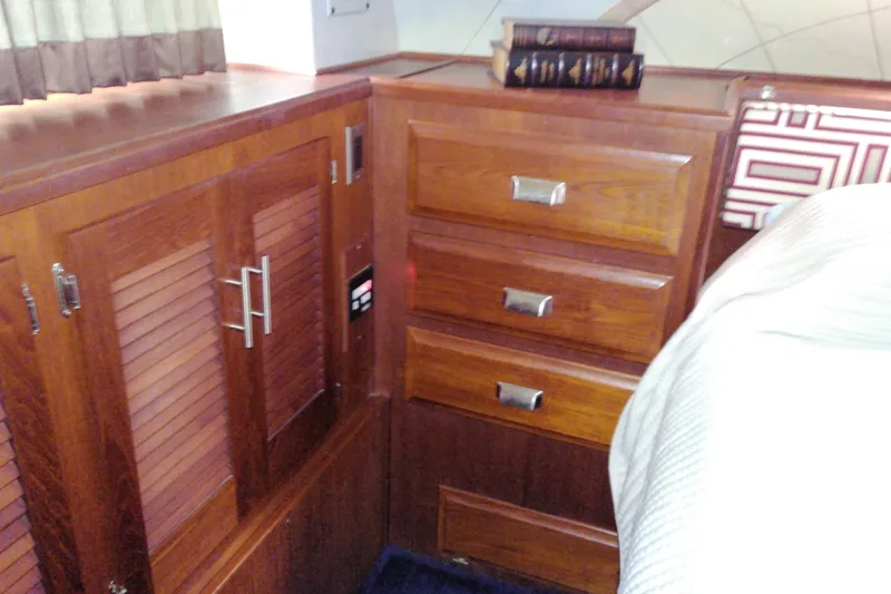 Slide: The Image of Interior of 1986 Viking 44 Motor Yacht with wooden cabinets and drawers. - 63