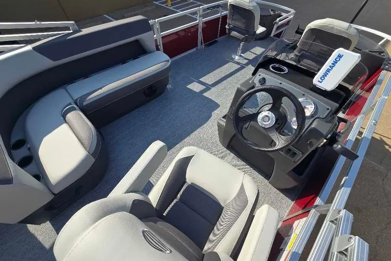 Slide: The Image of Interior of 2026 Sun Tracker Bass Buggy 18 DLX pontoon boat with seating and steering console. - 3