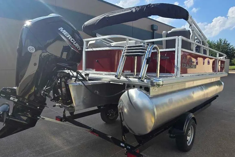 Slide: The Image of 2026 Sun Tracker Bass Buggy 18 DLX pontoon boat with Mercury outboard motor. - 8