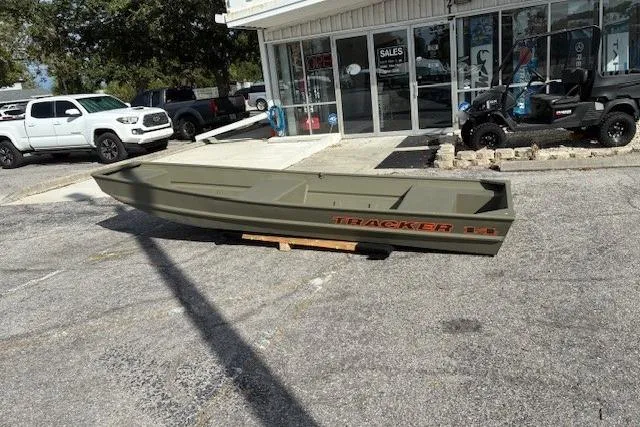 The Image of 2026 Tracker Grizzly 14 Jon boat displayed outside a dealership. - 0
