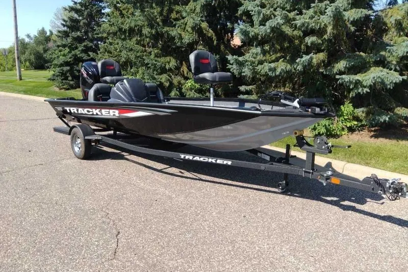 The Image of 2026 Tracker Pro Team 190 boat on trailer, parked on a sunny street. - 0