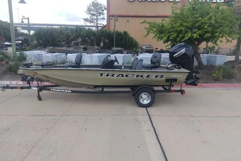 The Image of 2026 Tracker Pro Team 175 boat on trailer, parked outdoors. - 0