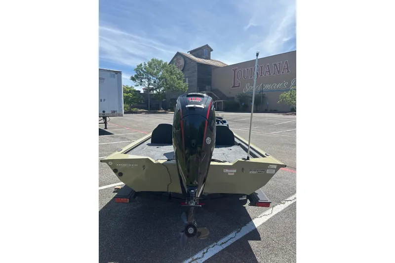 Slide: The Image of 2026 Tracker Pro Team 190 boat parked outside Louisiana Sportsman's building. - 9