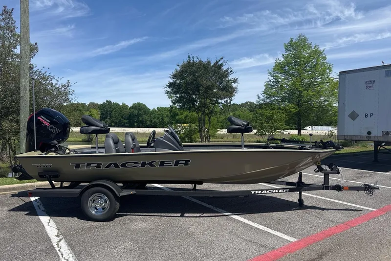 Slide: The Image of 2026 Tracker Pro Team 190 boat on trailer in parking lot, sunny day. - 11