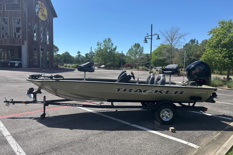 Slide: The Image of 2026 Tracker Pro Team 190 boat on trailer in parking lot, sunny day. - 10