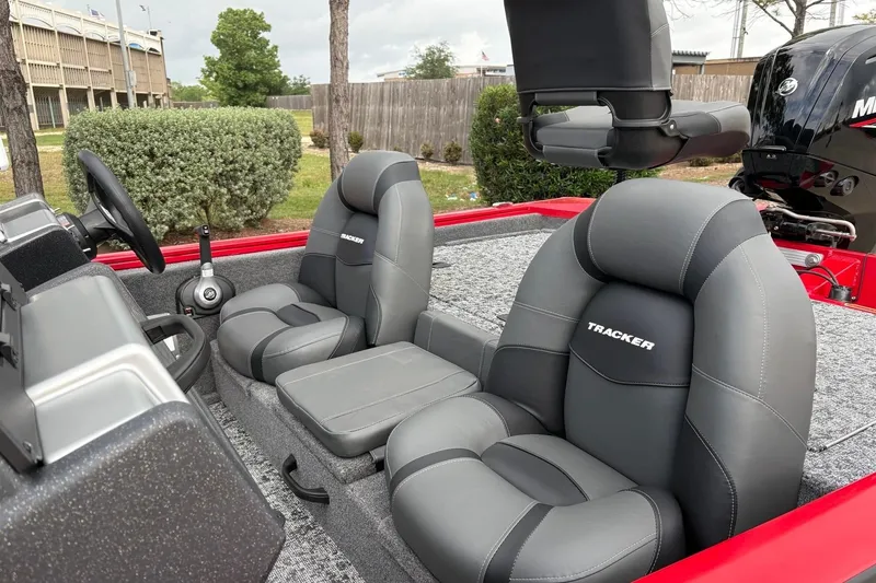 Slide: The Image of 2026 Tracker Pro Team 175 boat interior with gray seats and steering console. - 12