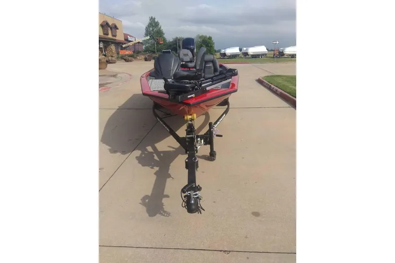 Slide: The Image of 2026 Tracker Pro Team 175 boat on a trailer in a parking lot. - 2