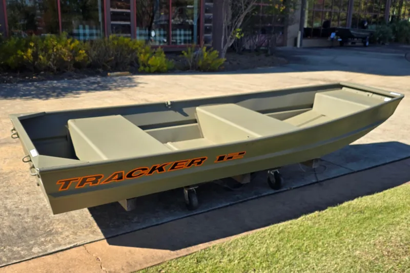 The Image of 2026 Tracker Grizzly 12 Jon boat on display outdoors. - 0