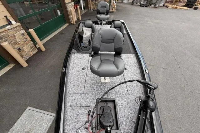 Slide: The Image of 2026 Tracker Pro Team 175 boat with dual seats and fishing equipment on deck. - 54