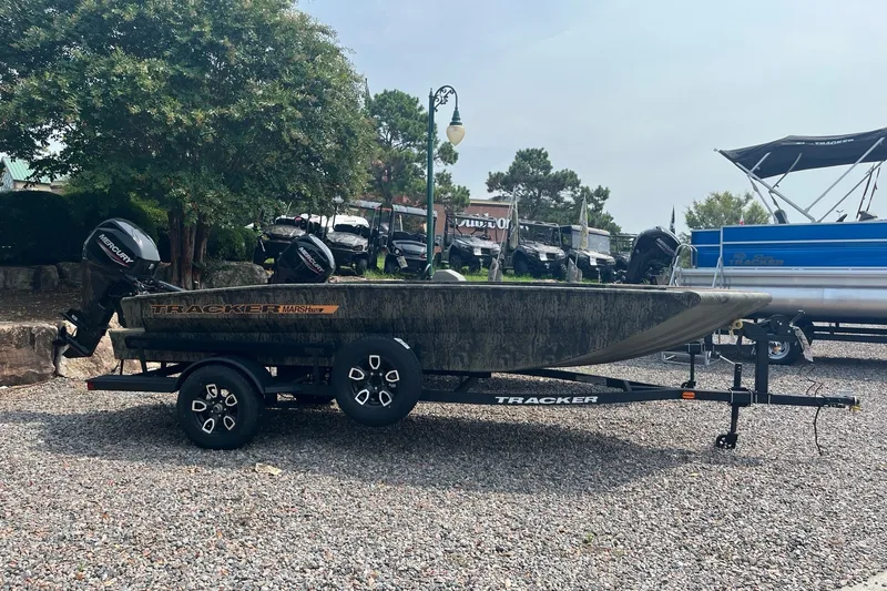 The Image of 2026 Tracker Grizzly 1756 T Marsh boat on trailer, parked outdoors. - 0