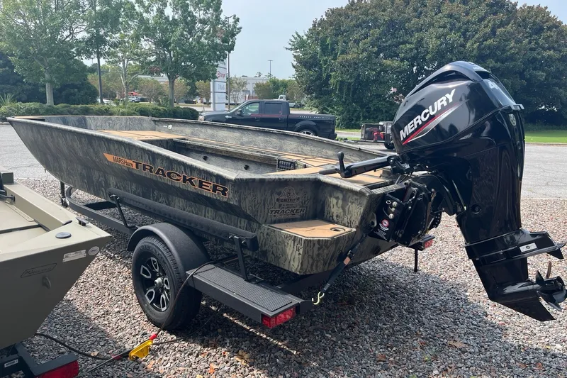 Slide: The Image of 2026 Tracker Grizzly 1756 T Marsh boat with Mercury engine on trailer. - 3