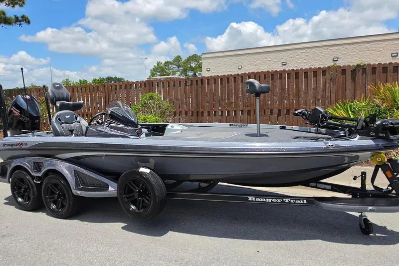 Slide: The Image of 2026 Ranger Z521R Cup-Equipped boat on trailer, parked outdoors under a blue sky. - 4