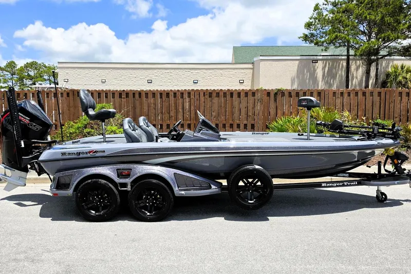 Slide: The Image of 2026 Ranger Z521R Cup-Equipped boat with sleek design, parked outdoors on a sunny day. - 8