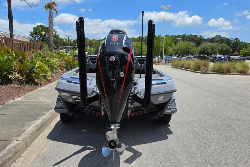 Slide: The Image of 2026 Ranger Z521R Cup-Equipped boat with powerful outboard motor, parked outdoors. - 19
