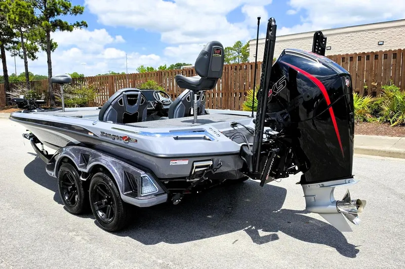 Slide: The Image of 2026 Ranger Z521R Cup-Equipped boat with powerful outboard motor, parked outdoors. - 9
