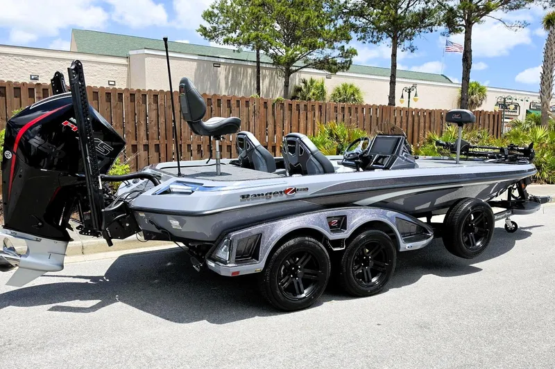 Slide: The Image of 2026 Ranger Z521R Cup-Equipped boat with sleek design and advanced features, parked outdoors. - 1