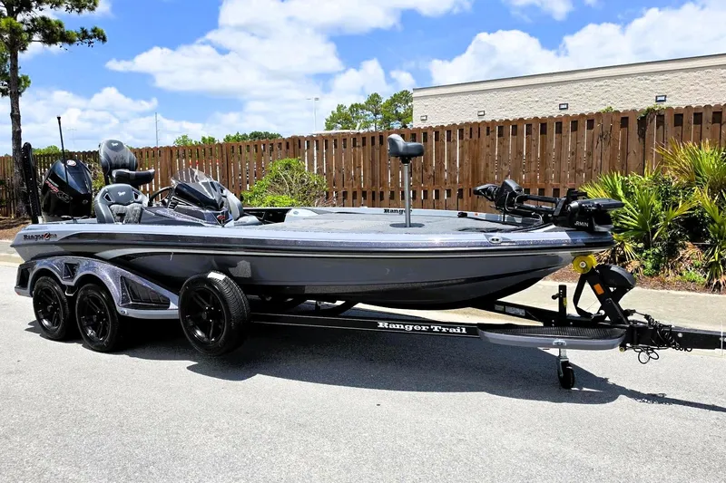 Slide: The Image of 2026 Ranger Z521R Cup-Equipped boat on trailer, parked outdoors under a clear sky. - 3