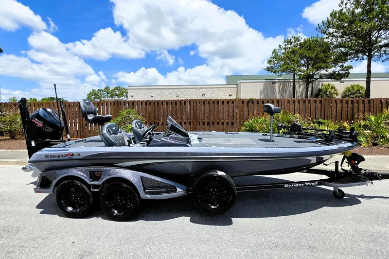 Slide: The Image of 2026 Ranger Z521R Cup-Equipped boat on trailer, parked outdoors under a clear blue sky. - 5