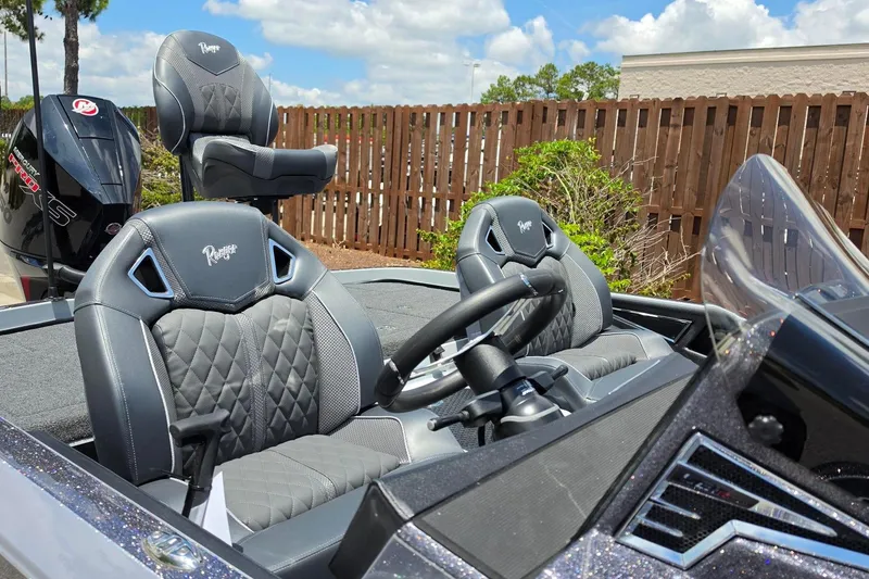 Slide: The Image of 2026 Ranger Z521R Cup-Equipped boat interior with premium seating and steering wheel. - 14