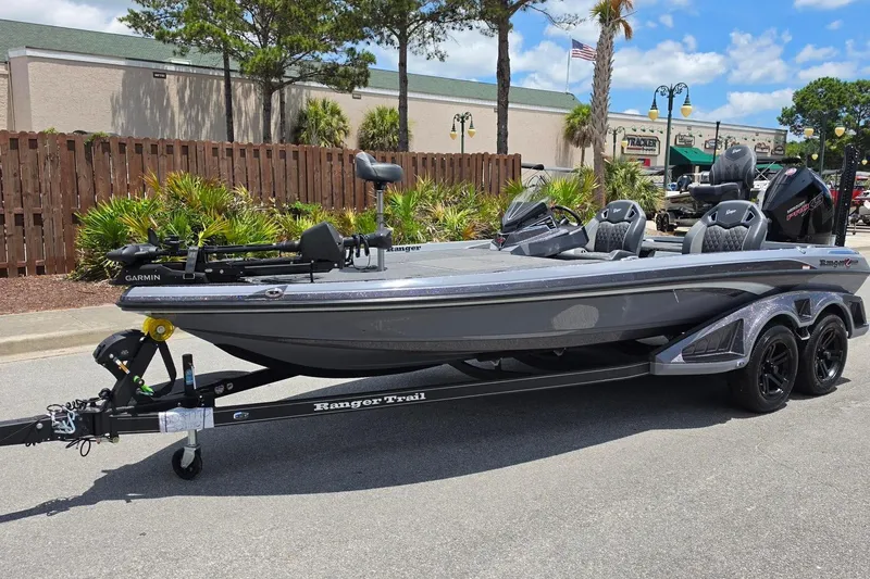 Slide: The Image of 2026 Ranger Z521R Cup-Equipped boat on trailer, parked outdoors, featuring sleek design and Garmin equipment. - 12