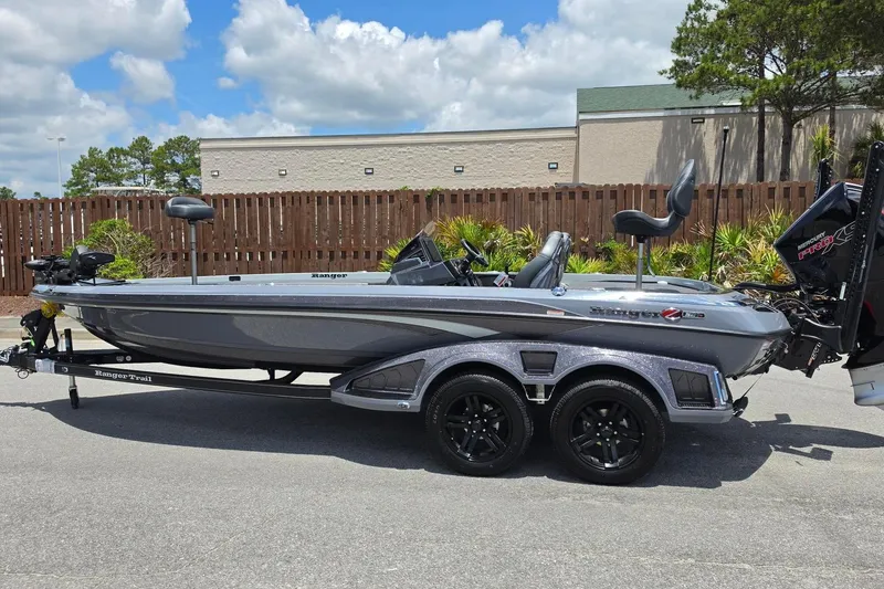 Slide: The Image of 2026 Ranger Z521R Cup-Equipped boat on trailer, parked outdoors under a cloudy sky. - 10