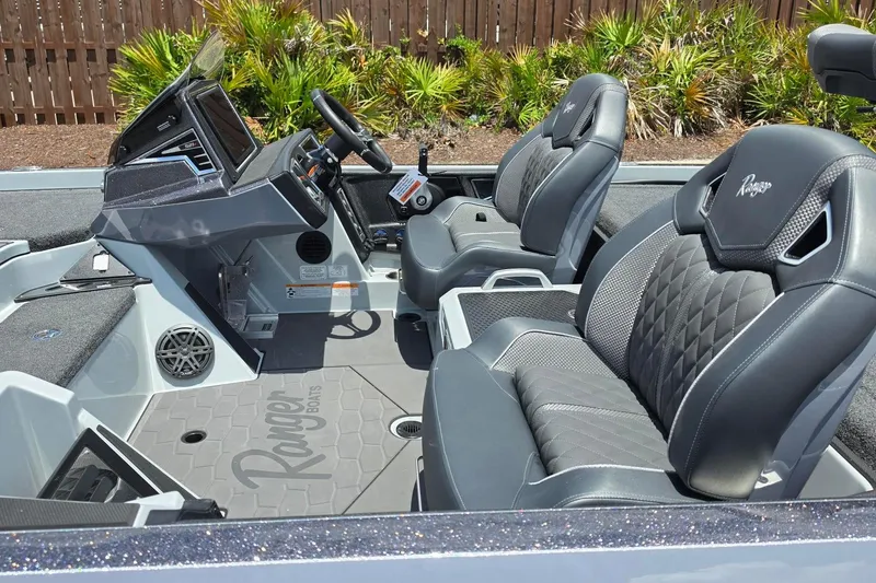 Slide: The Image of 2026 Ranger Z521R Cup-Equipped boat interior with modern seating and dashboard design. - 16