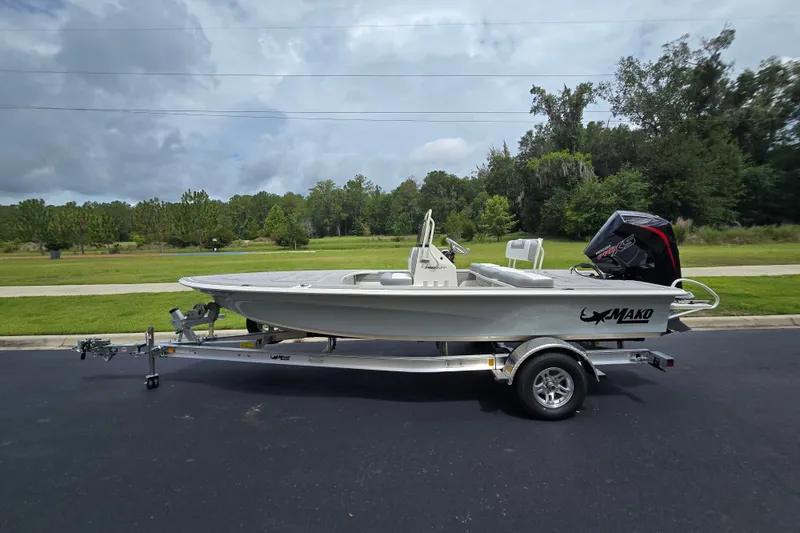 The Image of 2026 Mako 18 Pro Skiff boat on trailer, parked outdoors. - 0