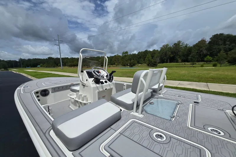Slide: The Image of 2026 Mako 18 Pro Skiff boat with modern design on a scenic road. - 4